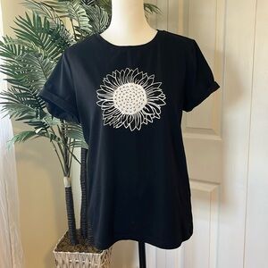 Black short sleeved t shirt with white sunflower print, size medium
